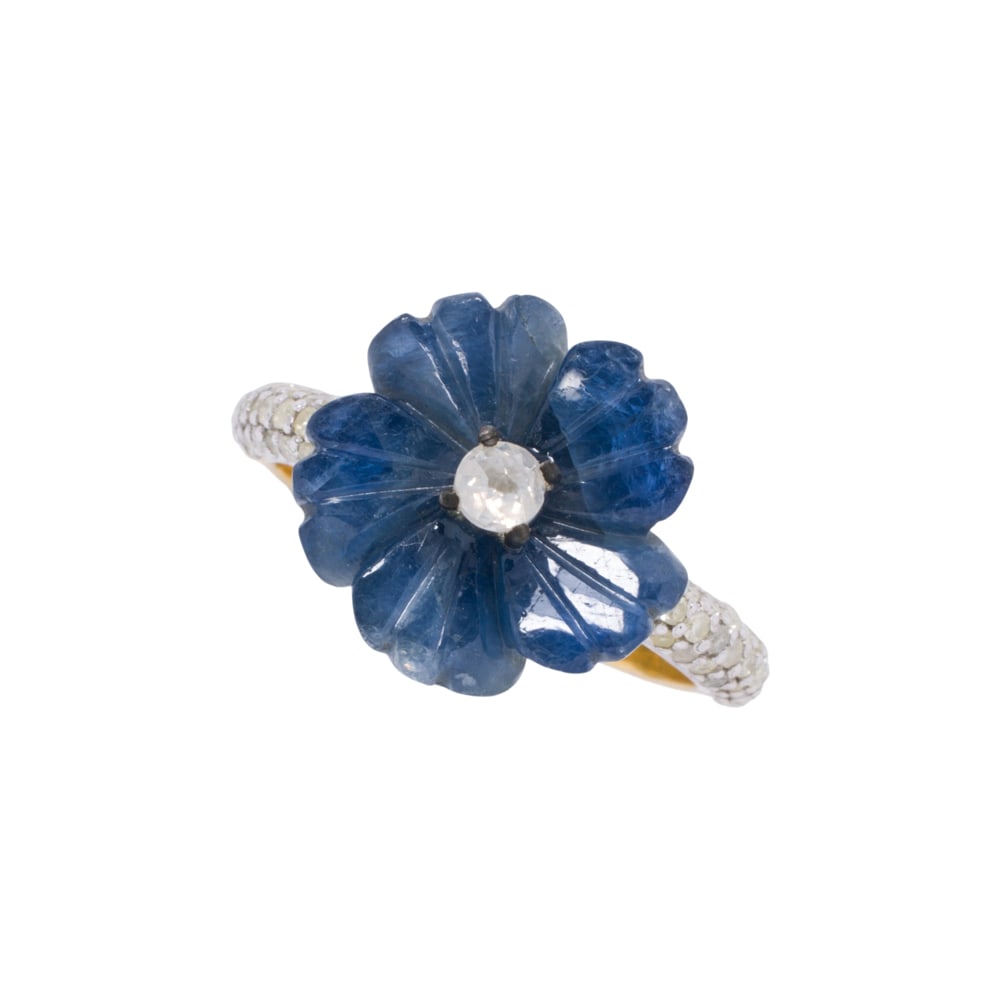 A sapphire, diamond, 14k gold and silver ring: A sapphire, diamond, 14k gold and silver ring featuring a carved sapphire flower, weighing approximately: 7.50 carats, centering a rose-cut diamond, accented by single cut diamond shoulders in silver,