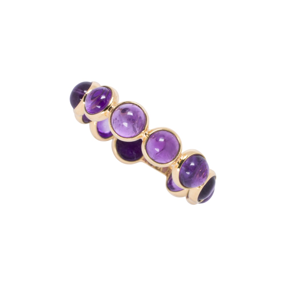 A amethyst and 18k gold ring: A amethyst and 18k gold ring A concentric design with round amethyst cabochons each measuring approximately 3.75 mm; size: 6 1/2 in; 1.80 grams