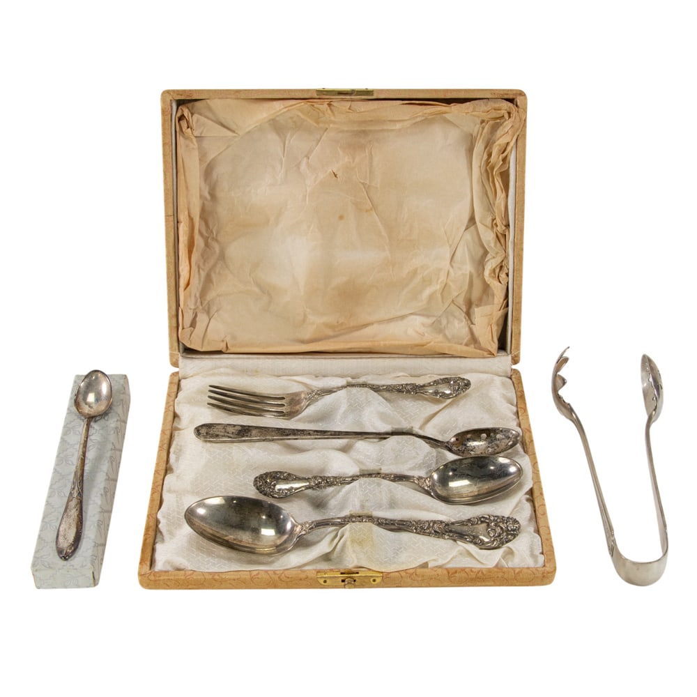 A sterling flatware group: A sterling flatware group, comprising: boxed part youth flatware set: fork, teaspoon, dessert spoon, Durgin, Marechal Niel, monogrammed; a pair of ice tongs, Durgin, Fairfax, monogrammed; an iced