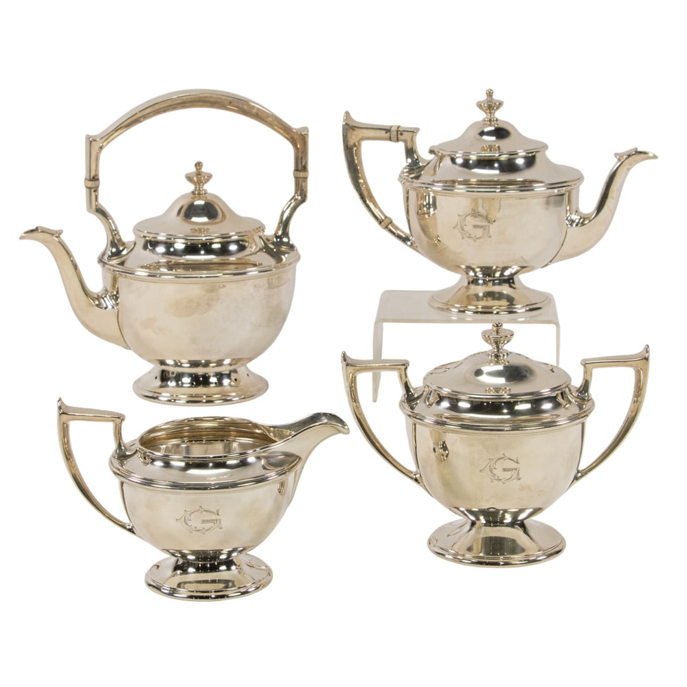 A sterling four piece tea set, Durgin Division of Gorham: A sterling four piece tea set, Durgin Division of Gorham, #464, monogrammed: G, comprising: kettle, teapot, sugar bowl with cover and a cream pitcher. H. of kettle: 8 3/4 in. (48.84 oz t.)