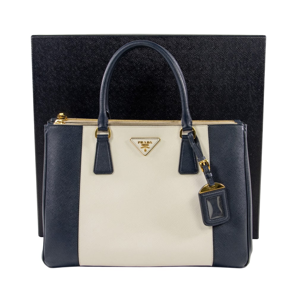 A Prada two-tone Saffiano Lux Galleria handbag: A Prada two-tone Saffiano Lux Galleria handbag, circa 2013, the limited production medium double-zip tote in Talco cream and Baltico blue cross-hatch leather with gold-tone hardware, together with rem