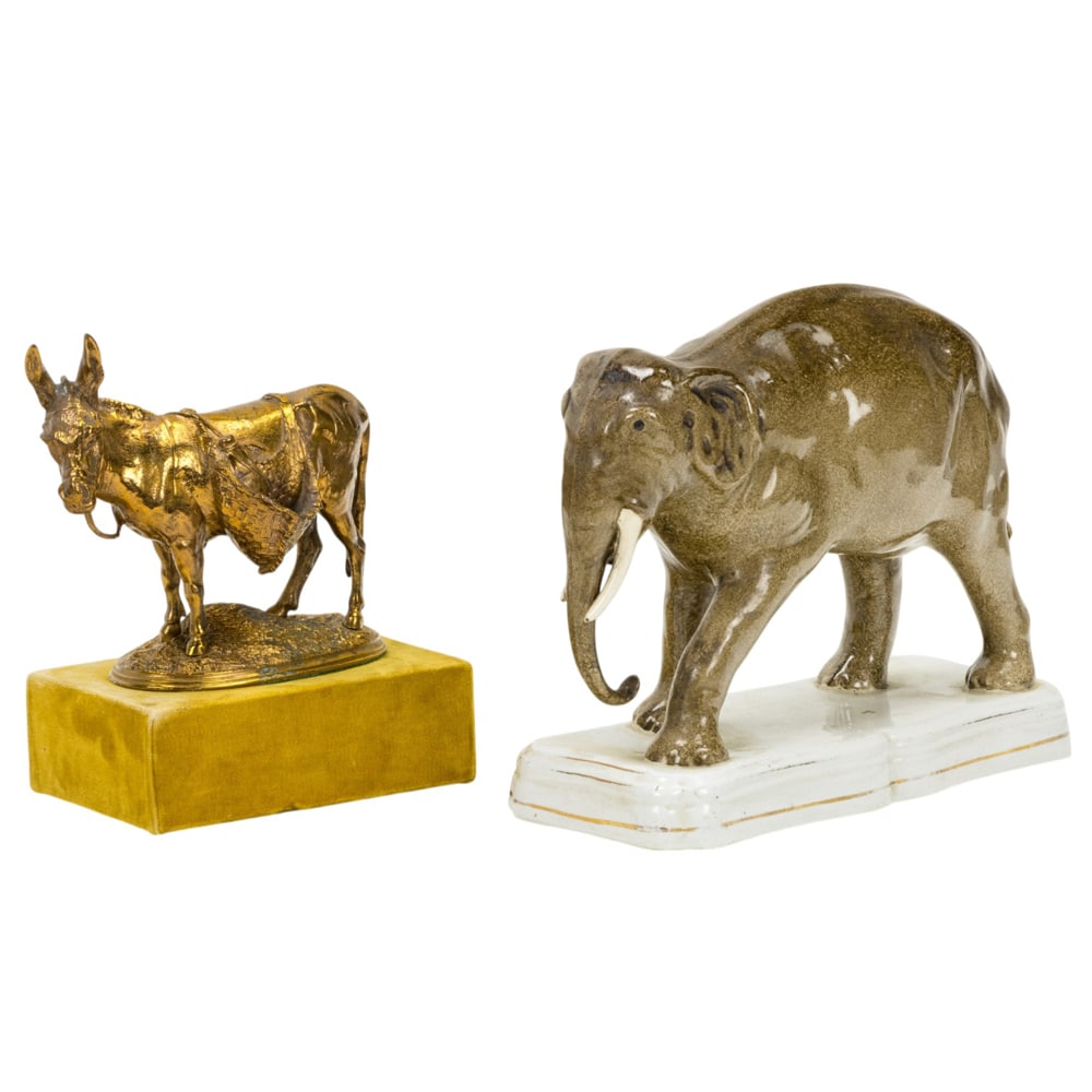 A Staffordshire style pottery figure of an elephant and a patinated metal animalier study of African (1 of 5)
