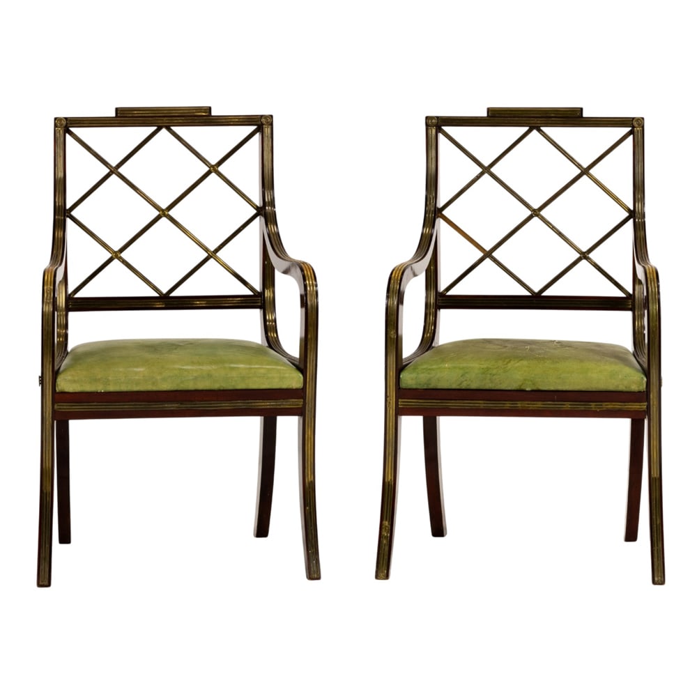A pair of Russian Nicholas I brass mounted mahogany armchairs 19th century: A pair of Russian Nicholas I brass mounted mahogany armchairs 19th century, each having a lattice back with brass fronts continuing to the leather seat, the entire frame fronted with reeded mounts, an