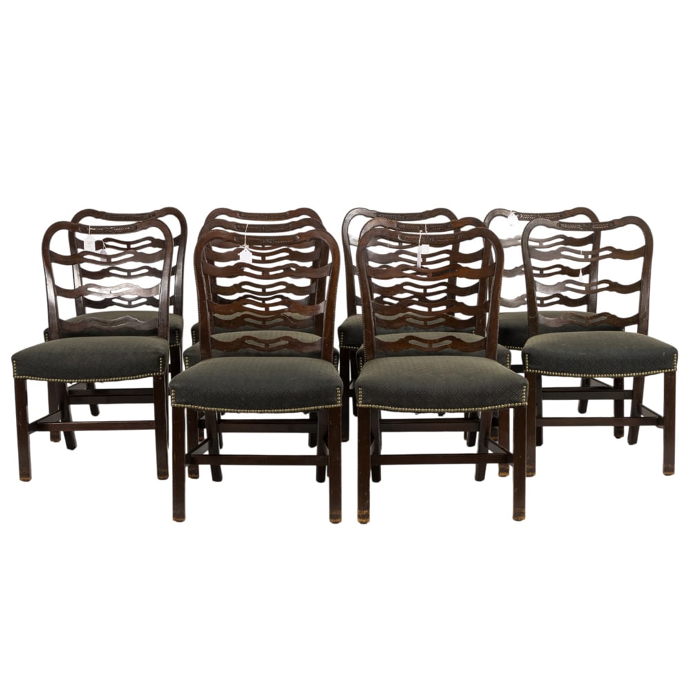 A suite of ten Chippendale style dining chairs: A suite of ten Chippendale style dining chairs, 20th century, the crestrail with a carved wheat sheaf reserve above the ladder back, the wide seat with brass nail head trim, and rising on square, cham