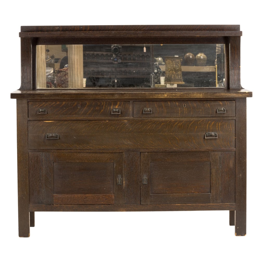 An American Arts and Crafts mirrored sideboard: An American Arts and Crafts mirrored sideboard, with original hardware, paneled doors, and rising on square legs, 51"h x 59.5"w x 22"d