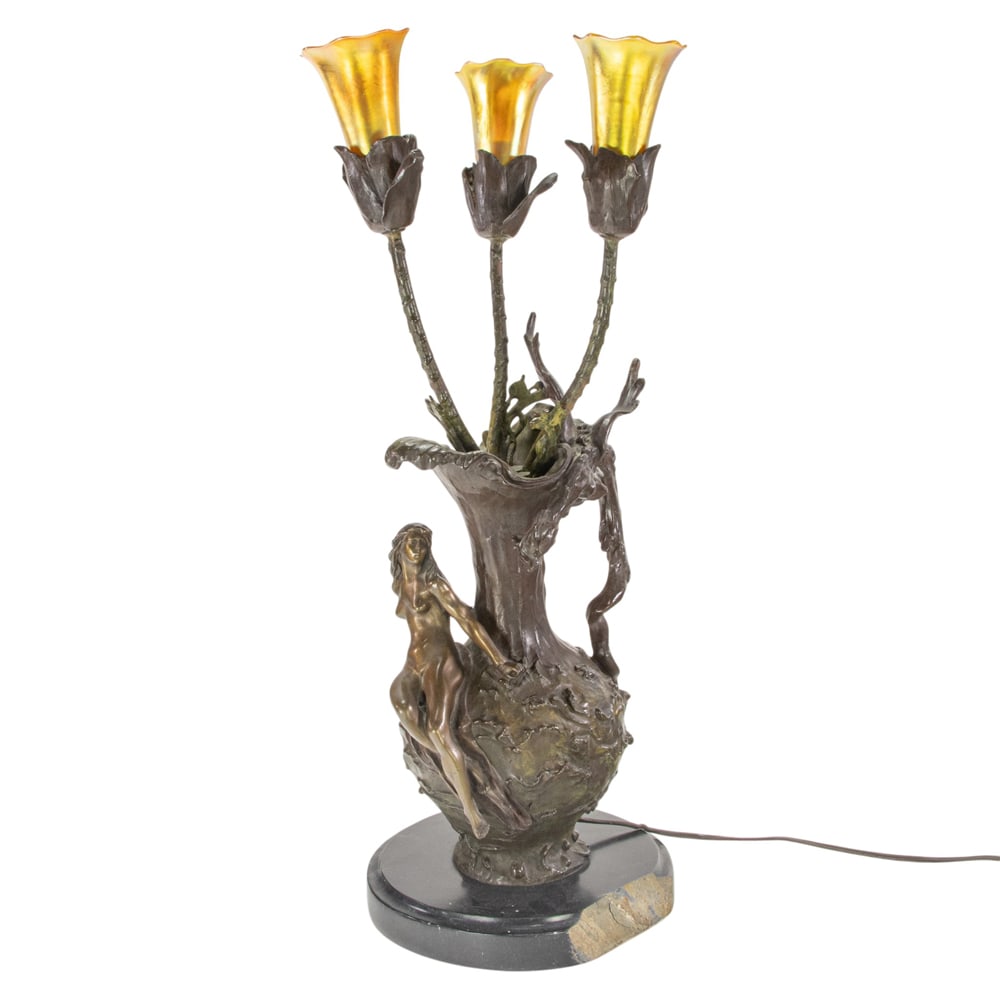 An Art Nouveau style patinated bronze figural table lamp with gold Aurene glass shades (1 of 3)