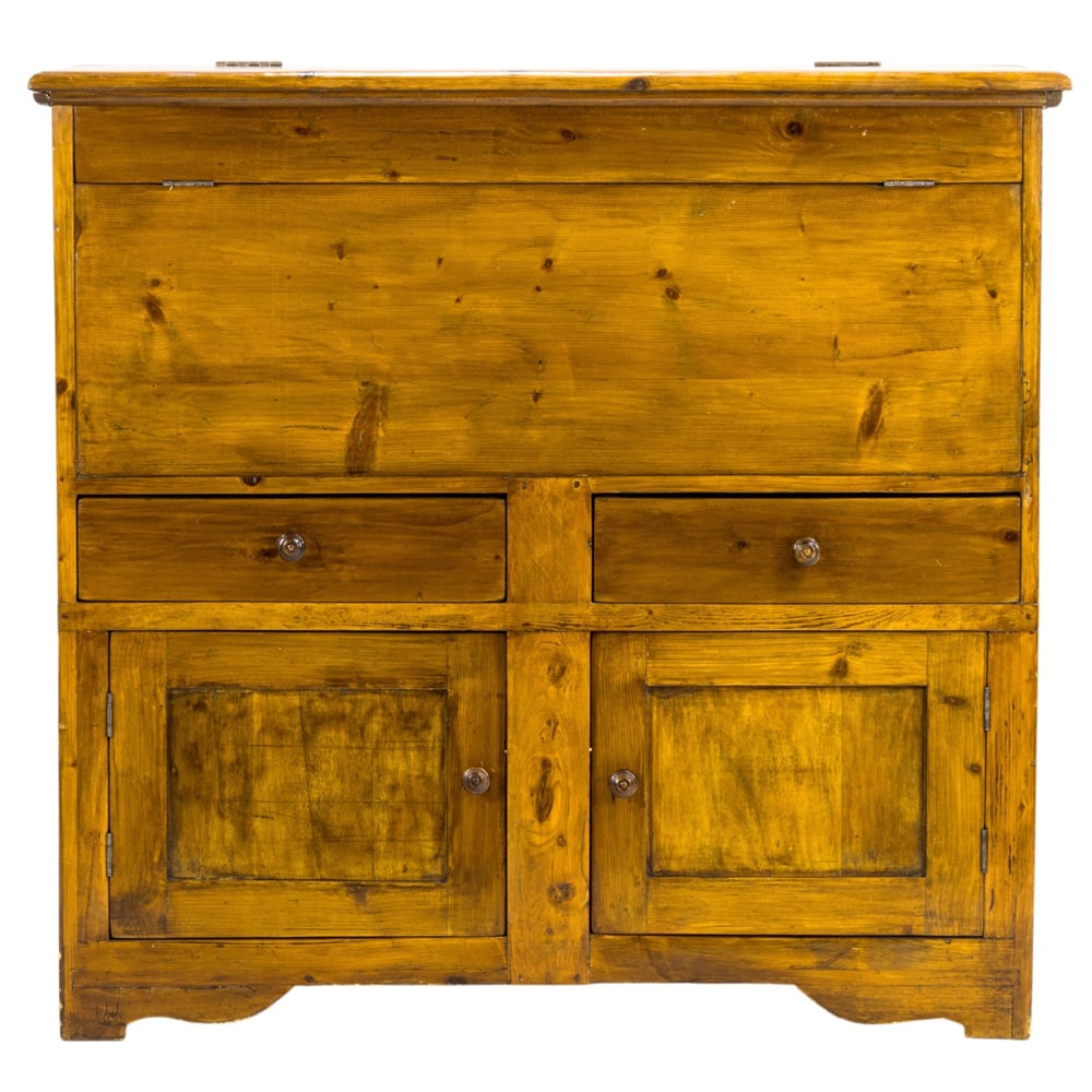 An Italian bread cupboard: An Italian bread cupboard, last quarter 18th century, with a hinged top opening to storage with a flip down storage vent, the lower case with two doors and rising on a molded base, 39"h x 41"w x 20"d