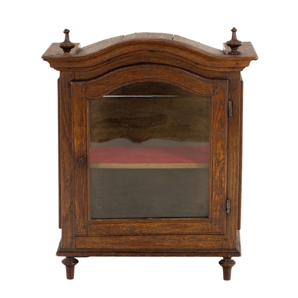 A French table vitrine: A French table vitrine, with a single door and rising on turned legs, 24"h x 20"w x 10"d