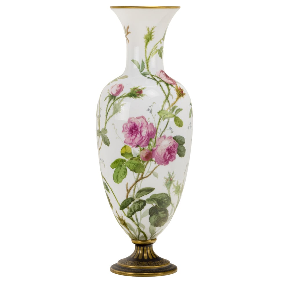 A large signed Baccarat opaline glass vase: A large signed Baccarat opaline glass vase, 1867, finely painted with rose sprays, on a bi-color gilt decorated foot, signed and dated 'Baccarat le 16 Mars 1867', 22"h x 8"dia (largest), Provenance: B