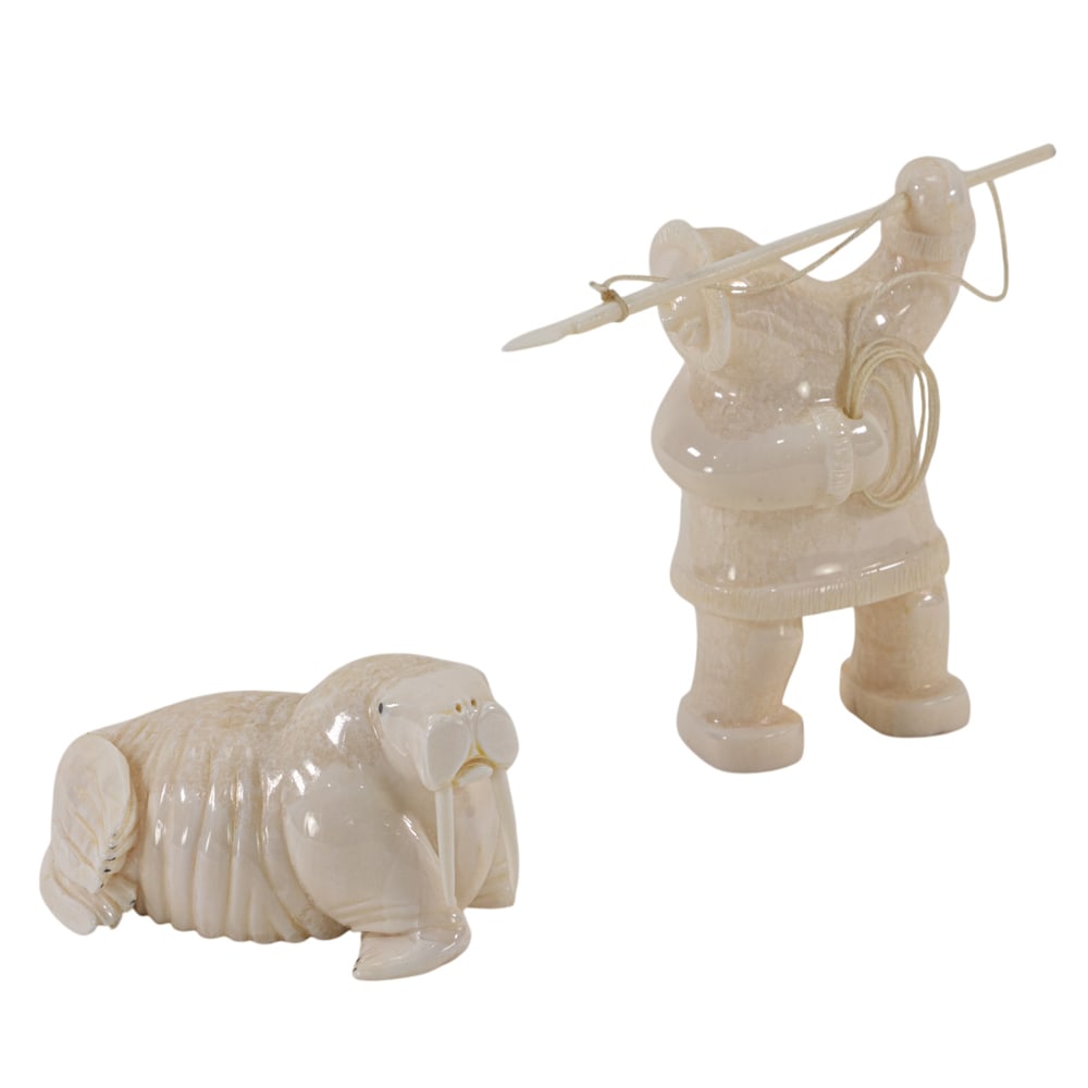 A Siberian Yupik carved walrus ivory group, Wilson Ifkaaqu Okoomealingok (1 of 3)