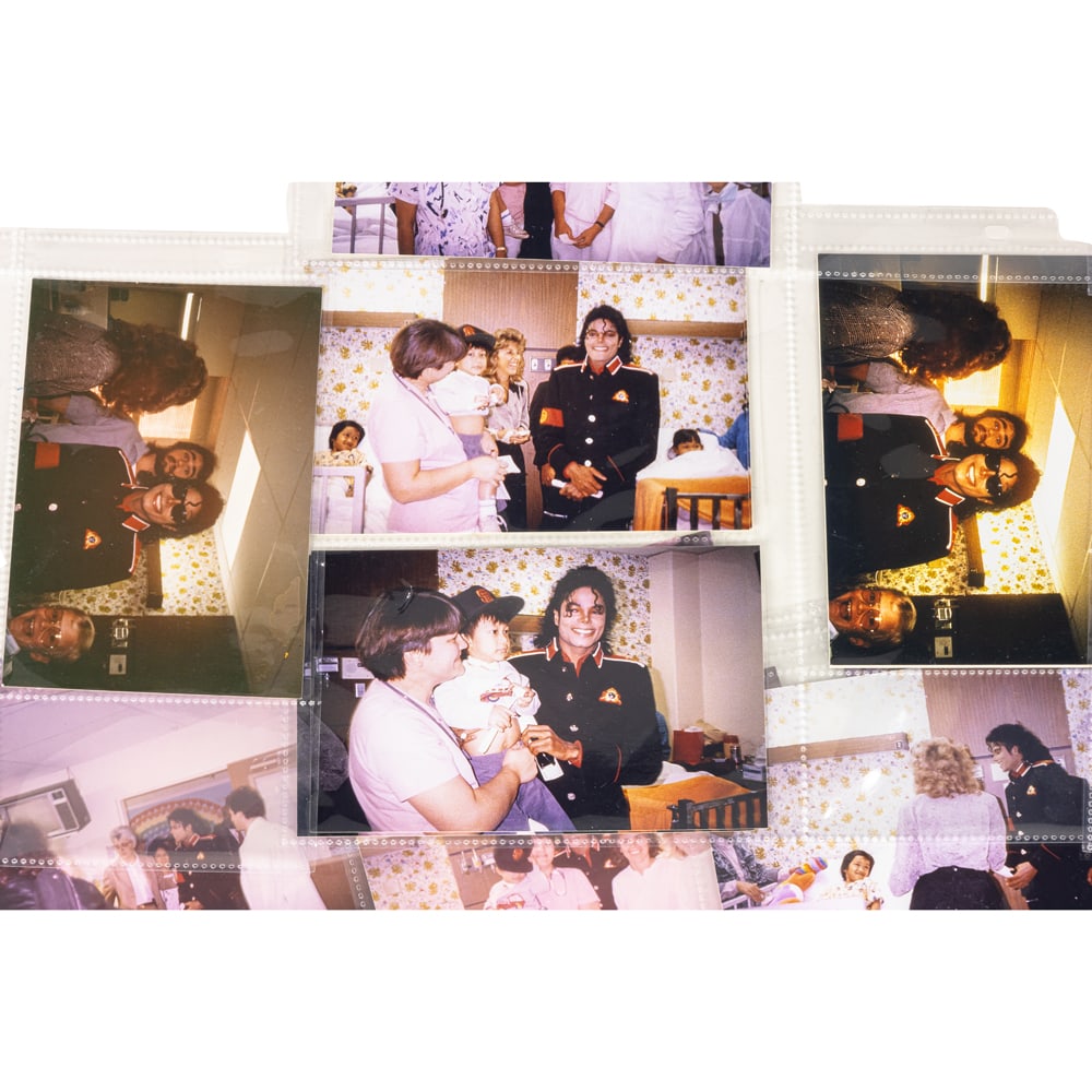 A collection of 48 original photographs of Michael Jackson's visit to hospitalized victims of the (1 of 9)