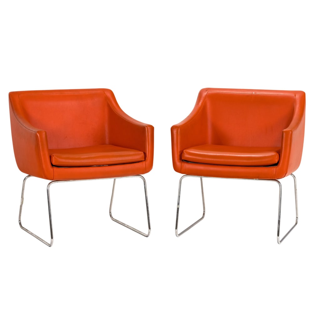 A pair of Vecta Group orange upholstered and chrome lounge chairs: A pair of Vecta Group orange upholstered and chrome lounge chairs, fitted with loose seat cushion, 30"h x 26.5"w x 22"d (overall); 18"h x 178"d (seat)