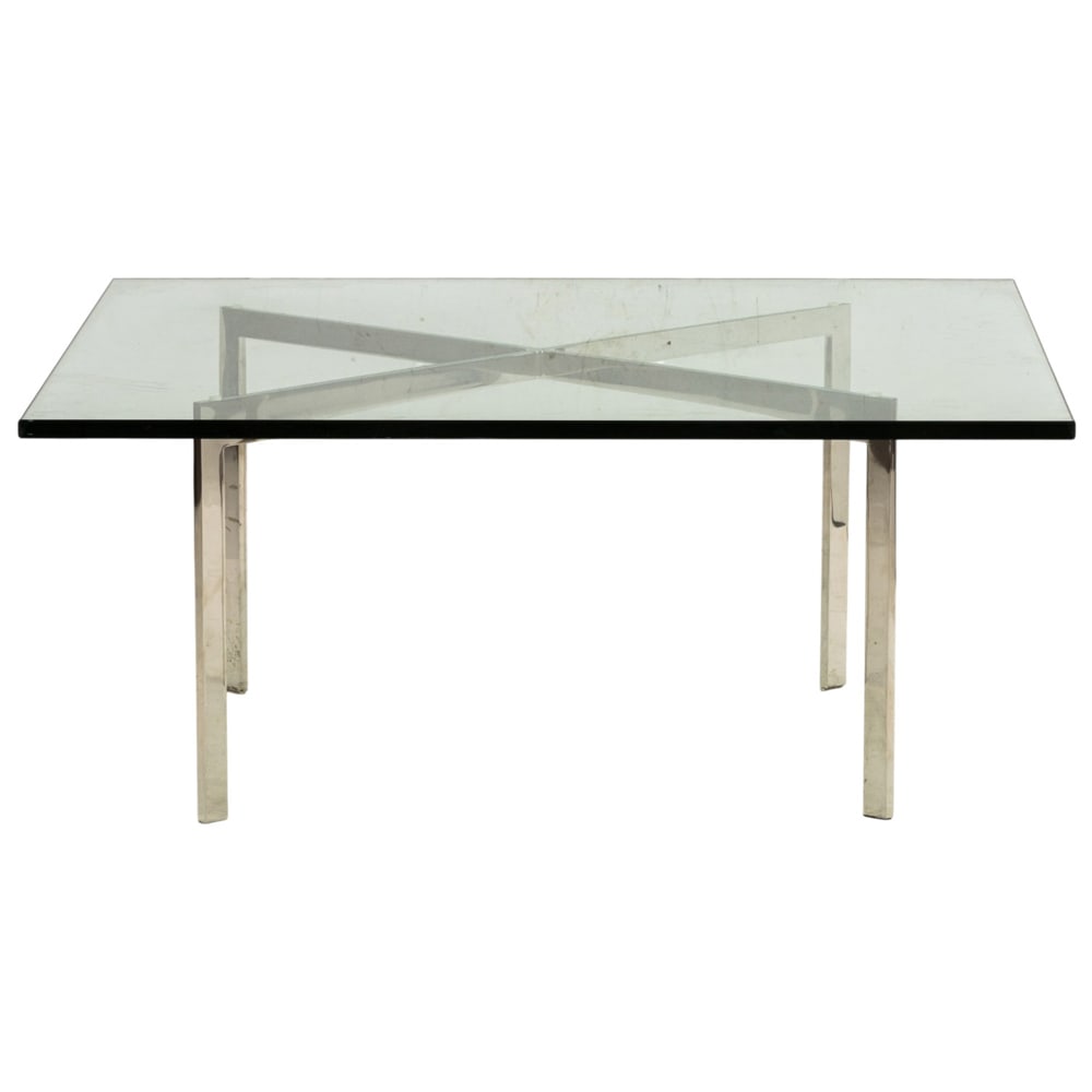 A Ludwig Mies van der Rohe Barcelona table, with a chrome X form base supporting the plate glass (1 of 3)