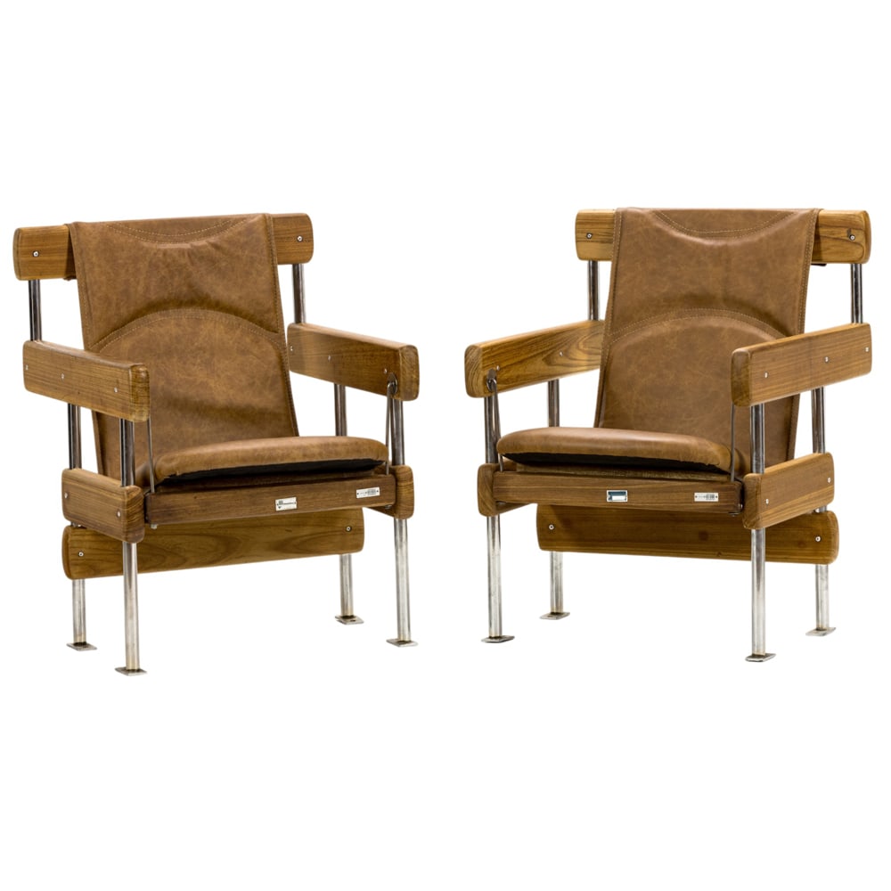 A pair of Brazilian Modern Sergio Rodrigues "Longarina" auditorium chairs: A pair of Brazilian Modern Sergio Rodrigues "Longarina" auditorium chairs, for Oca, Brazil, 1965 armchairs for Oca, with original plaque of Patrimonio, 31"h x 23.5"w x 23"d (overall); 16.5"h x 18.5"d 