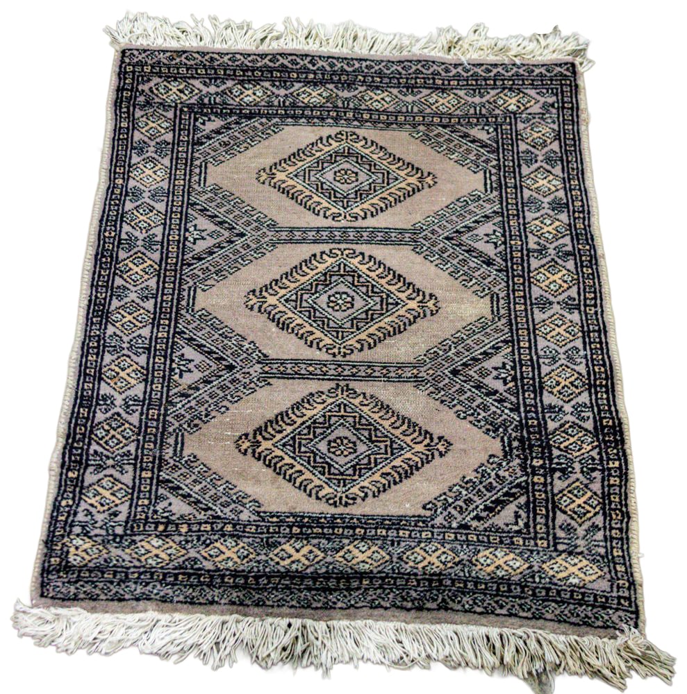 A Pakistani carpet: A Pakistani carpet, 3'2" x 2'3". Provenance: Purchased in the Kingdom of Bahrain.