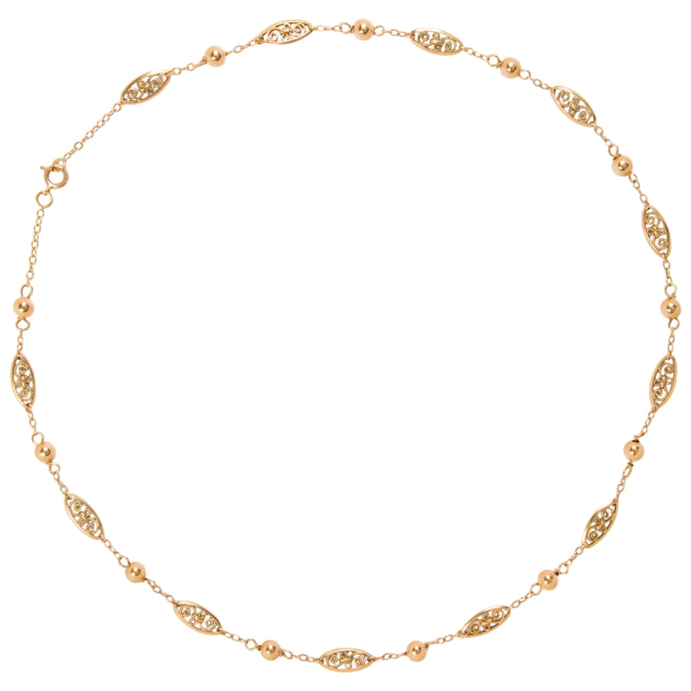 An 18k gold chain: An 18k gold chain The fancy link chain featuring ball-form spacers; length: 18 in; 8.65 grams