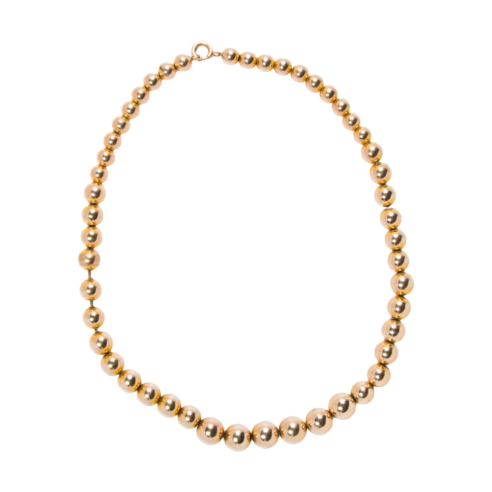 A 10k gold beaded necklace: A 10k gold beaded necklace Designed as a graduated strand of hollow-form 10k gold beads measuring from 7.21 to 11.01 mm; length: 17 1/2 in; 35.75 grams Note: central chain not tested for metal