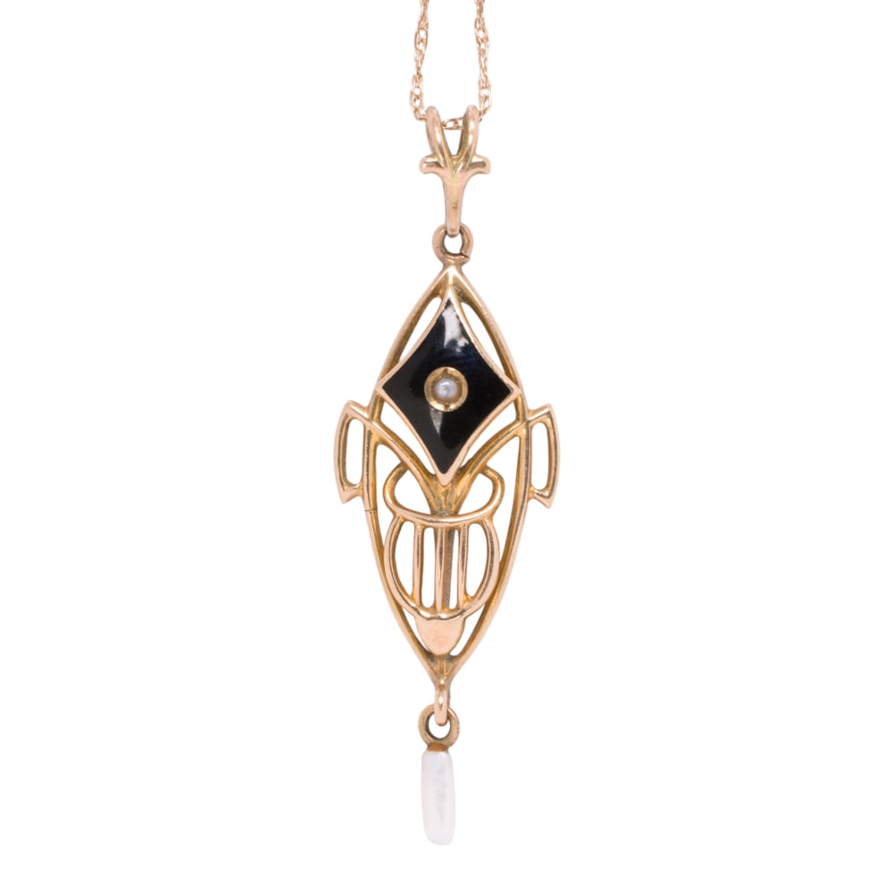 An onyx, cultured pearl, and gold pendant necklace: An onyx, cultured pearl, and gold pendant necklace The 10k gold pendant of lavalier style, set with an onyx tablet, one seed pearl, and one cultured pearl measuring 5.60 mm, on fancy link 14k gold