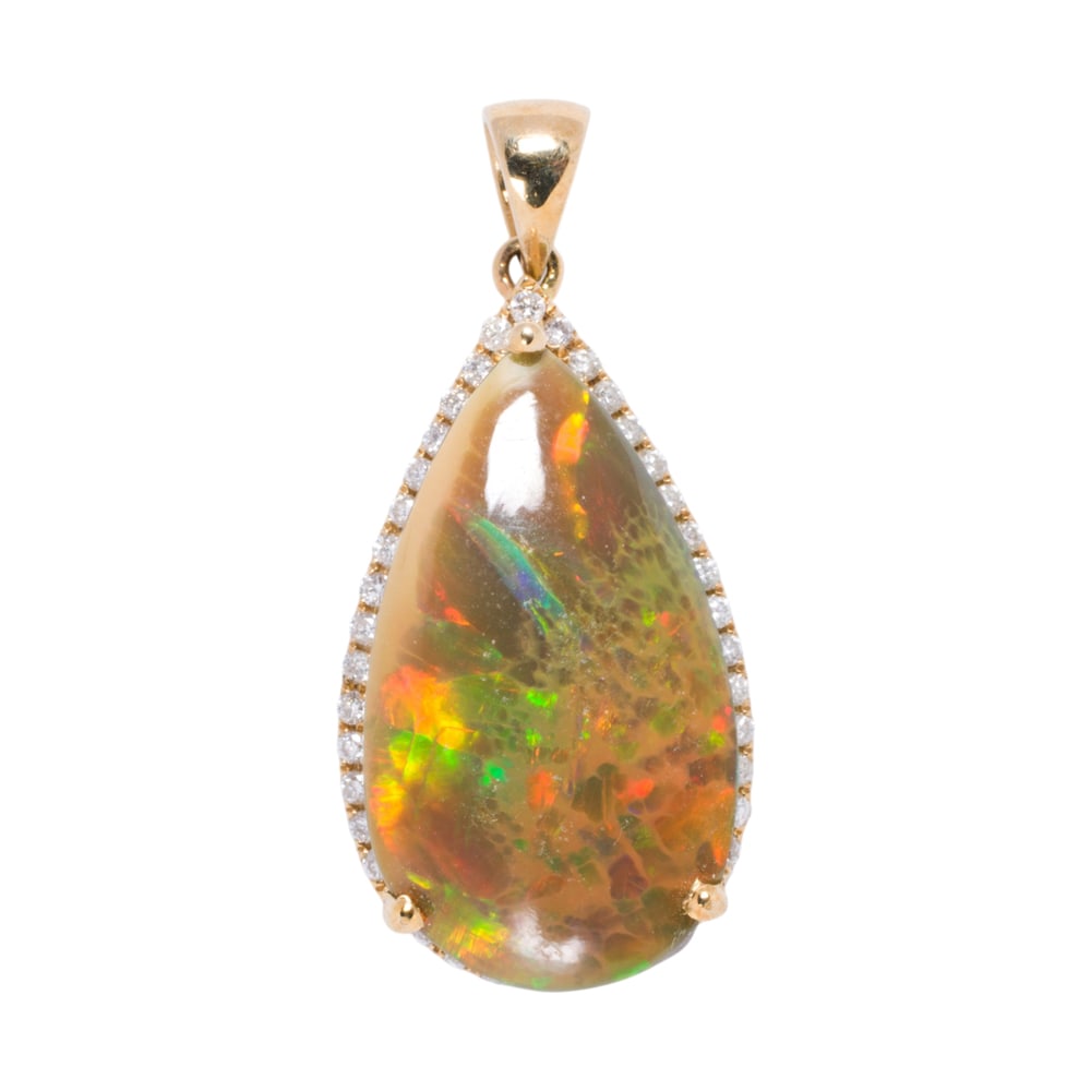 An opal, diamond, and 14k gold pendant: An opal, diamond, and 14k gold pendant Centering a pear-shaped opal cabochon measuring 23.66 x 13.28 x 5.99 mm, framed by 40 round-cut diamond; length: 1 1/4 in; 4.25 grams