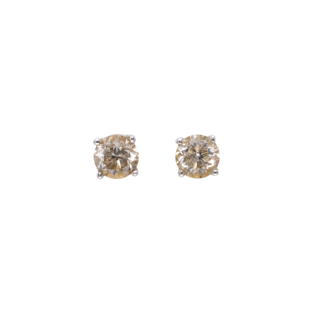 A pair of 14k gold diamond solitaire earrings: A pair of 14k gold diamond solitaire earrings Set with round brilliant-cut diamonds weighing approximately 0.45 carat; 1.15 grams