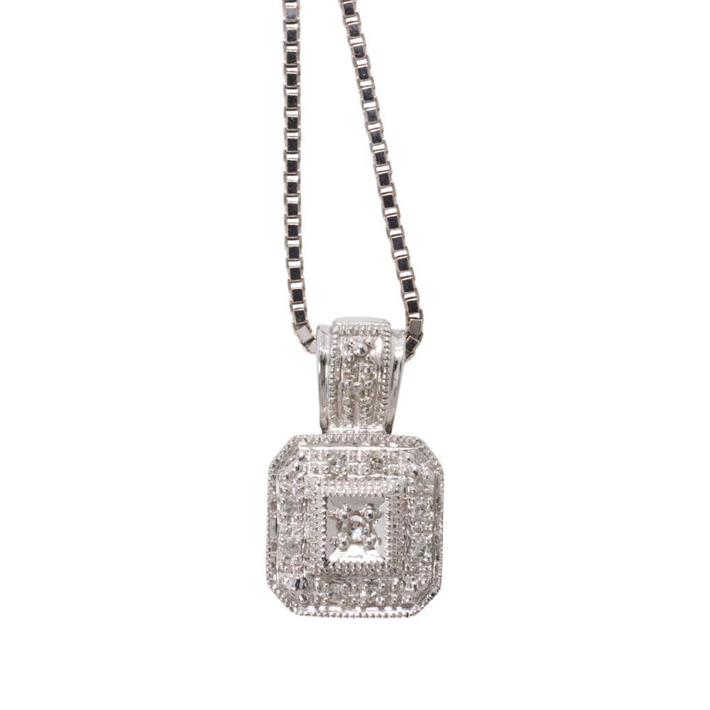 A diamond and white gold pendant necklace: A diamond and white gold pendant necklace The 10k white gold pendant set with single-cut diamonds, with 14k white gold box link chain; pendant length: 5/8 in; chain length: 18 in; 5.40 grams