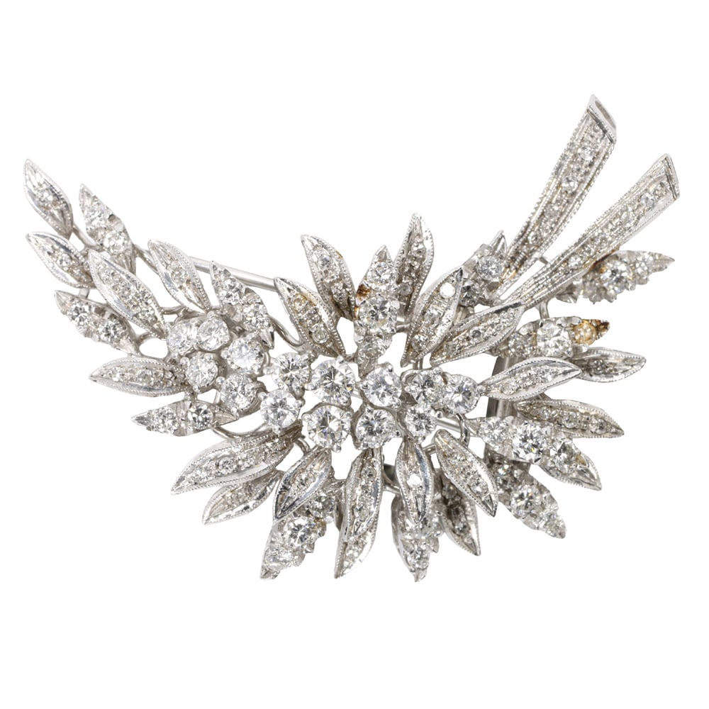 A diamond and 18k white gold brooch: A diamond and 18k white gold brooch the spray brooch set with numerous round brilliant and single-cut diamonds weighing approximately 1.55 carats in total; 20.60 grams; length: 2 in