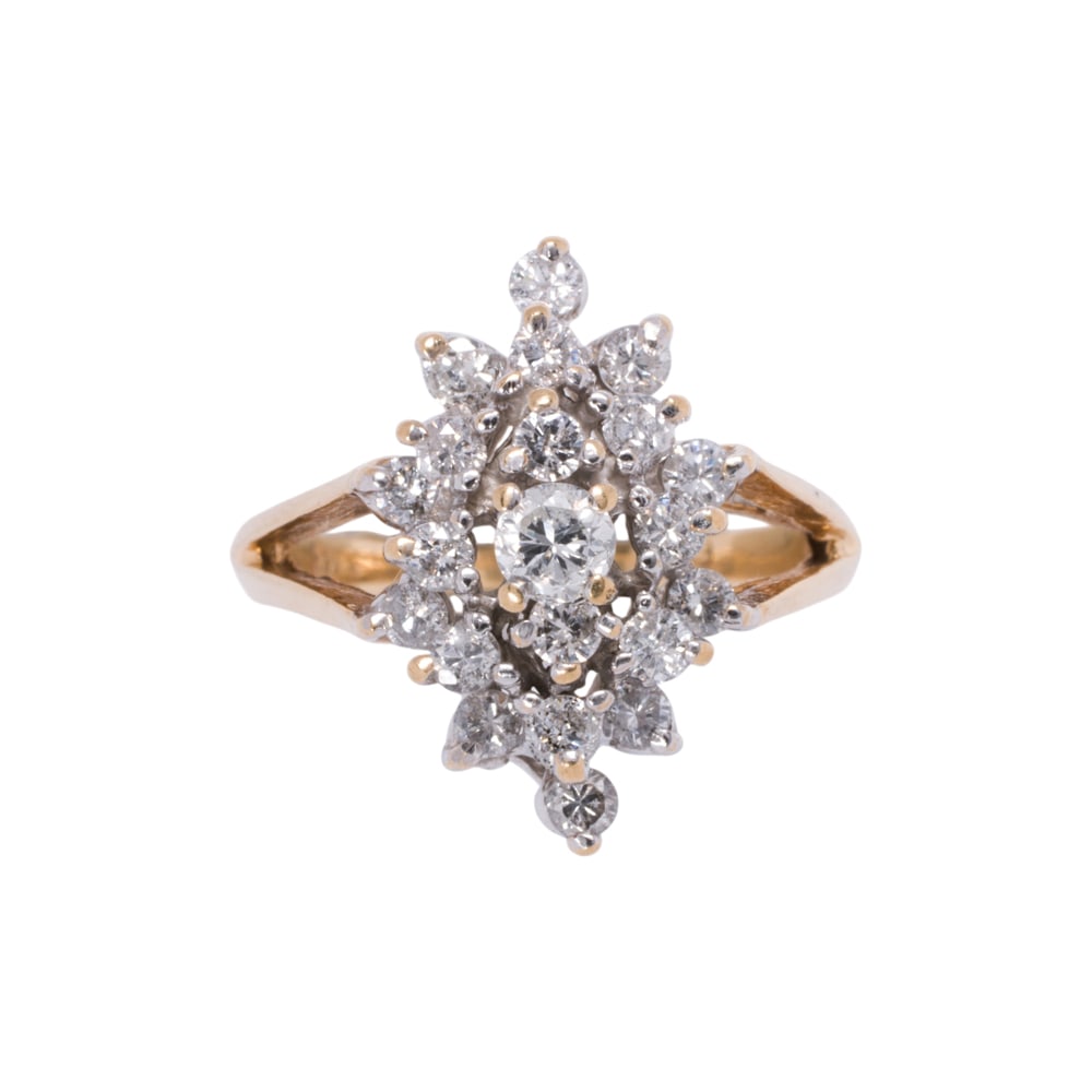 A diamond and 14k gold cocktail ring: A diamond and 14k gold cocktail ring Set with 21 round brilliant-cut diamonds weighing 0.70 carat; size 6; 4.70 grams