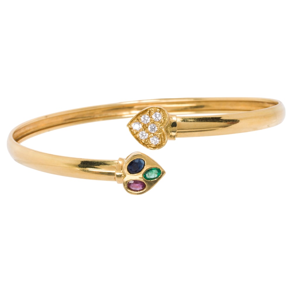 A gem-set and 18k gold bracelet: A gem-set and 18k gold bracelet The bracelet set with one oval-cut ruby, sapphire, and emerald, and six round-cut transparent gemstones; length: 8 3/4 in; 11.70 grams