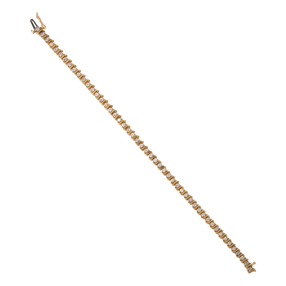 A diamond and 14k gold tennis bracelet: A diamond and 14k gold tennis bracelet Set with 49 round brilliant-cut diamonds weighing a total of approximately 2.40 carats; length: 7 1/4 in; 10.15 grams