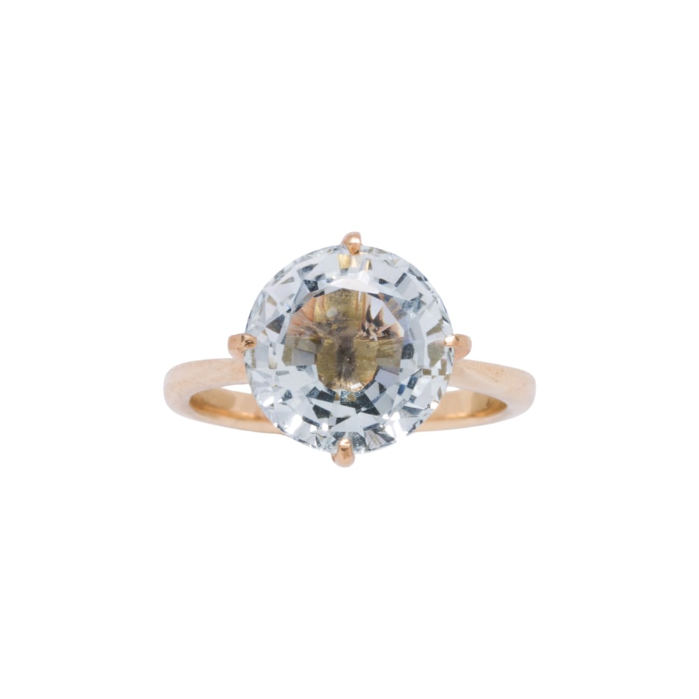 An aquamarine and 14k gold ring: An aquamarine and 14k gold ring Centering a round-cut aquamarine weighing approximately 2.70 carats; size 5; 2.90 grams