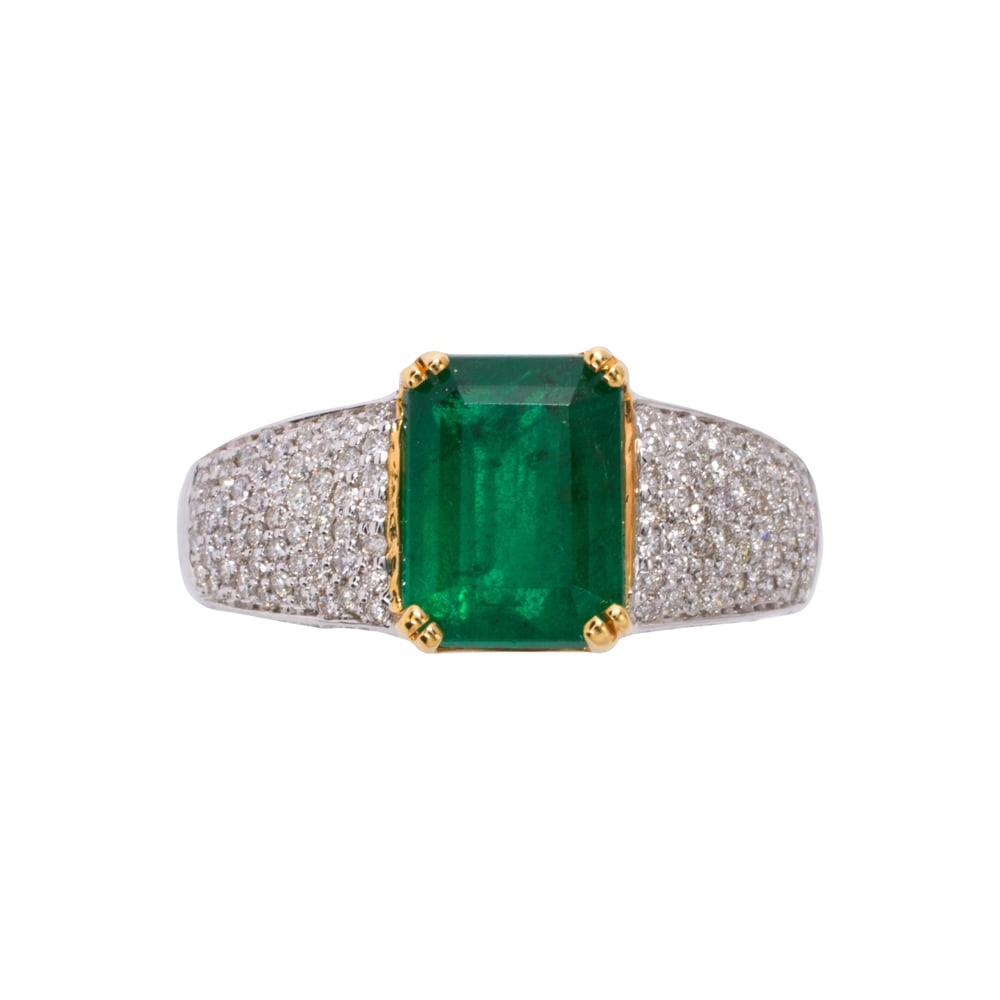 An emerald, diamond, and 14k gold ring: An emerald, diamond, and 14k gold ring Centering an emerald-cut emerald weighing 3.12 carats, with round brilliant-cut diamond shoulders; total diamond weight: 0.86 carat; size 7 1/4; 6.60 grams