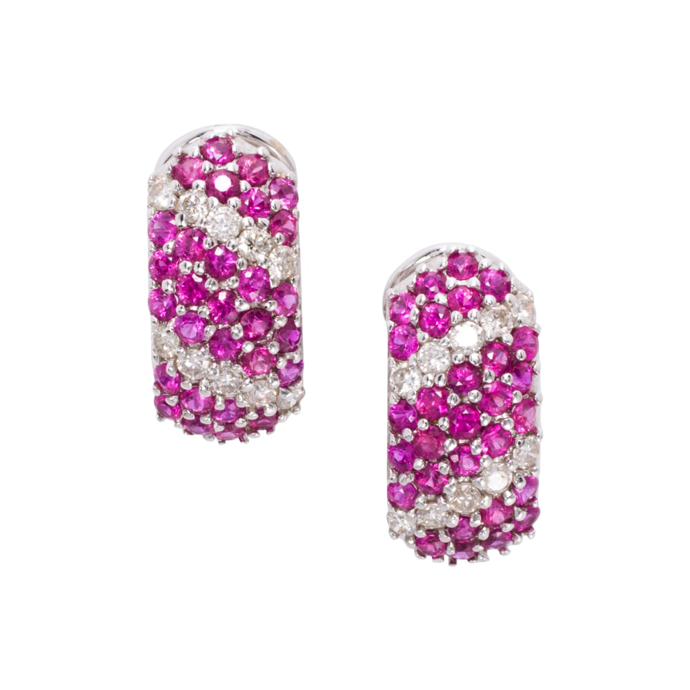 A pair of ruby, diamond, and 14k white gold earrings: A pair of ruby, diamond, and 14k white gold earrings Set with 29 round-cut rubies, interspersed by rows of round brilliant-cut diamonds; estimated total ruby weight: 1.70 carats; estimated total