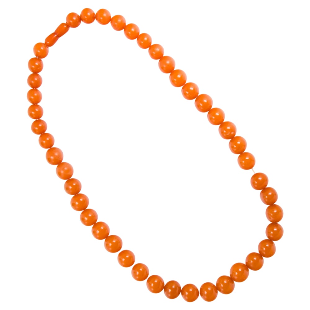 An amber beaded necklace: An amber beaded necklace Designed with a gradation of round-shaped amber beads measuring from 13.07 to 16.59 mm; length: 25 3/4 in; 76.50 grams