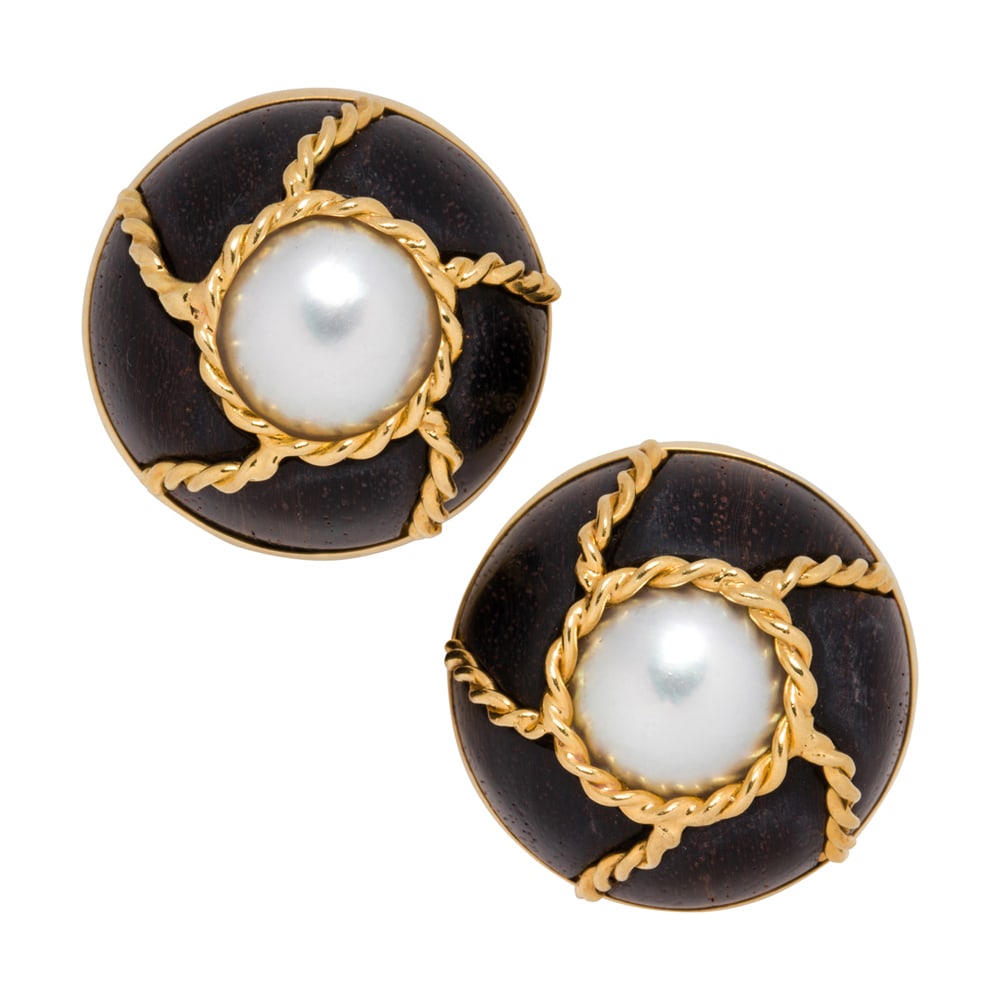 A pair of Seaman Schepps cultured pearl, wood, and 18k gold ear-clips: A pair of Seaman Schepps cultured pearl, wood, and 18k gold ear-clips Centering a mabe cultured pearl measuring approximately 10.70 mm, framed by wood and accented by twisted 18k gold wire; length: 1 