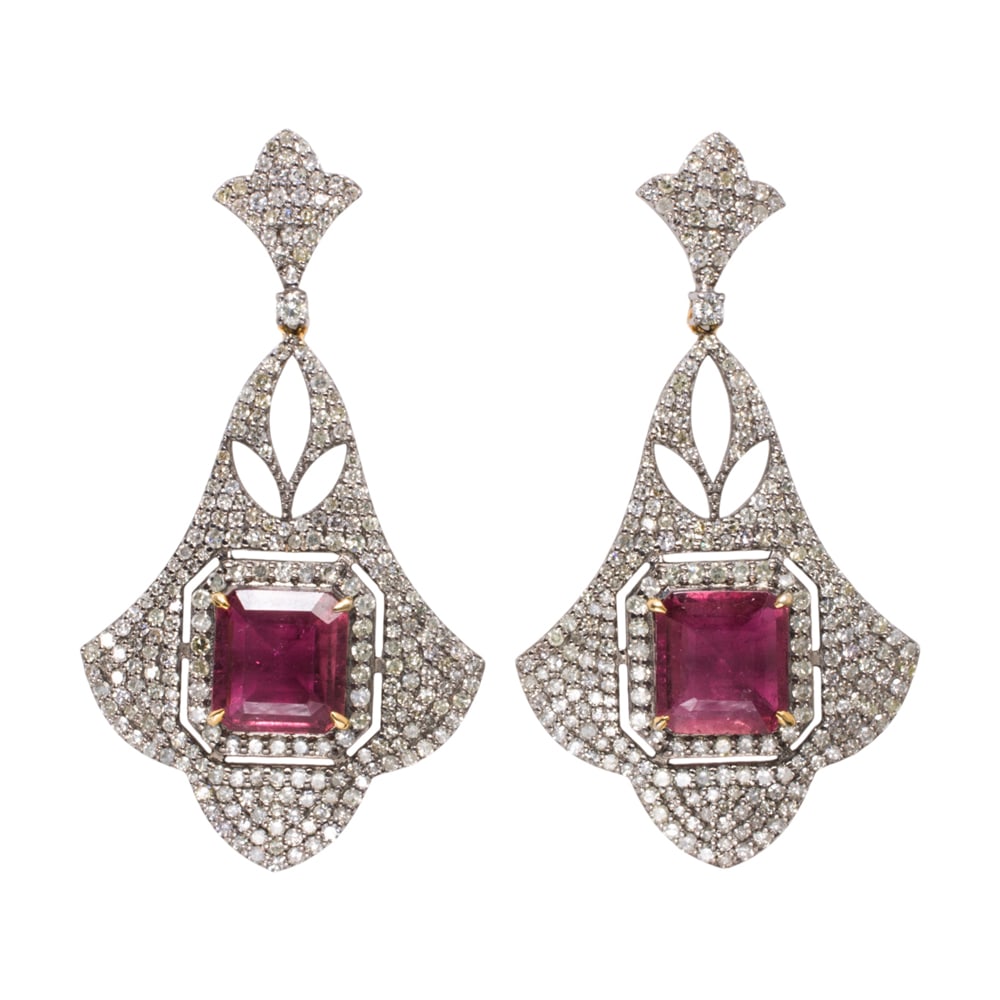 A pair of rubelite, diamond, silver, and 14k gold earrings: A pair of rubelite, diamond, silver, and 14k gold earrings The silver earrings set with emerald-cut rubelite tourmalines weighing a total of 5.61 carats, framed within an arrangement of round-cut