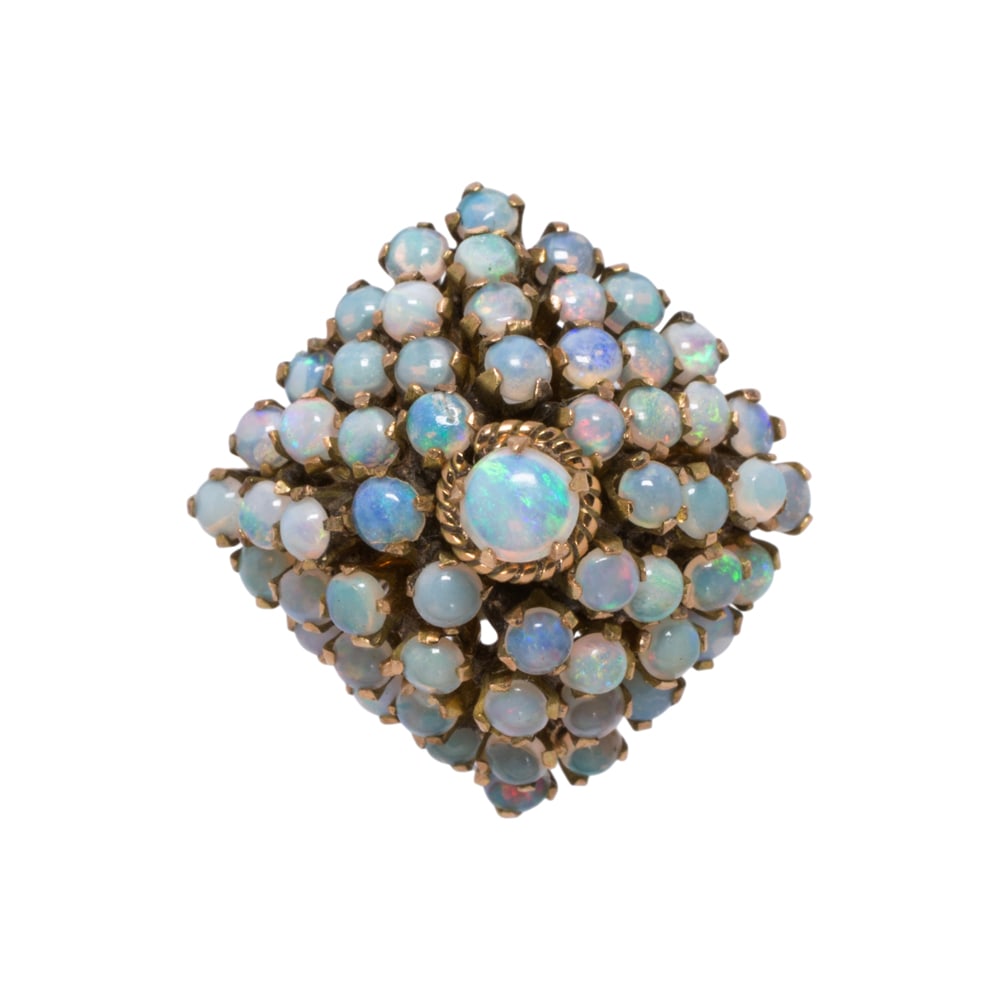 An opal and 14k gold ring: An opal and 14k gold ring Designed as a square-shaped dome, set with numerous round-shaped opal cabochons measuring 2-3.20 mm; size 6 1/4; 6.50 grams