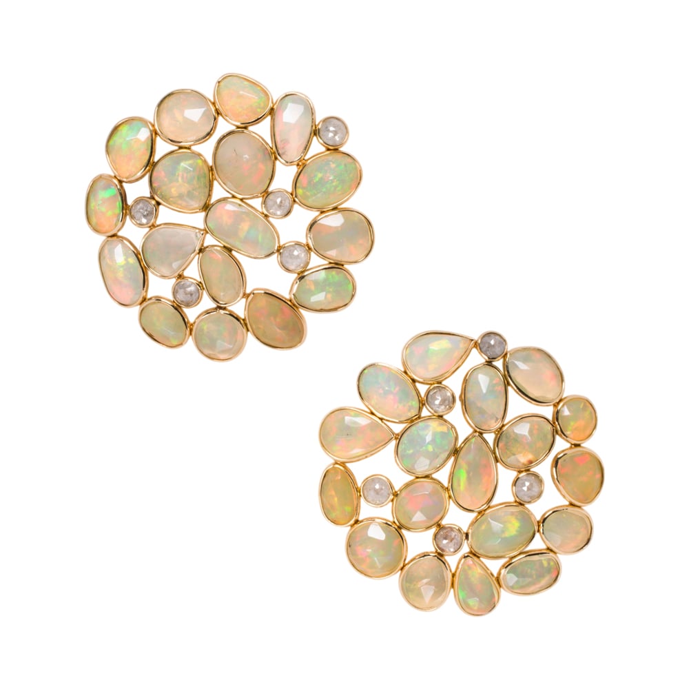 A pair of opal, diamond, and 18k gold earrings: A pair of opal, diamond, and 18k gold earrings Designed as an arrangement of oval and pear-cut opal cabochons, interspersed by round-cut diamonds; total opal weight: 11.56 carats; total diamond
