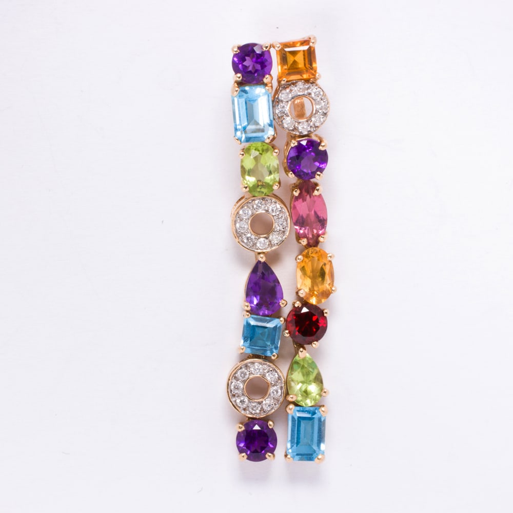 A diamond, gemstone, and 14k gold pendant: A diamond, gemstone, and 14k gold pendant Designed as two lines of topaz, amethyst, rose quartz, citrine, peridot and garnet, accented by discs of round brilliant-cut diamonds; 6.0 grams; length: 2 in