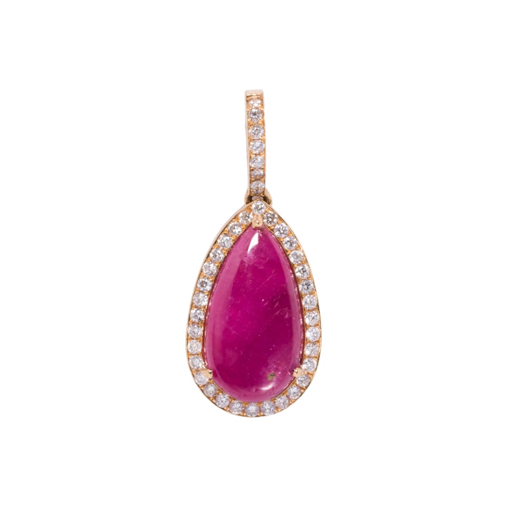 A ruby, diamond, and 18k gold pendant: A ruby, diamond, and 18k gold pendant Centering a pear-shaped ruby cabochon weighing 4.07 carats, with round-cut diamond surround and bail; length: 1 in; 2.80 grams