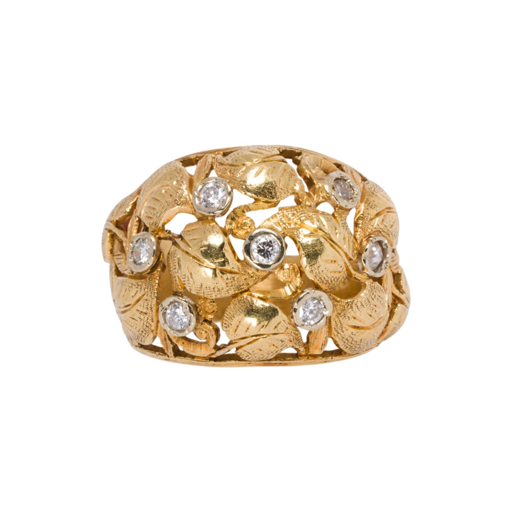 A diamond and 18k gold ring: A diamond and 18k gold ring Of foliate design, set with seven round brilliant-cut diamonds; size 5; 5.30 grams