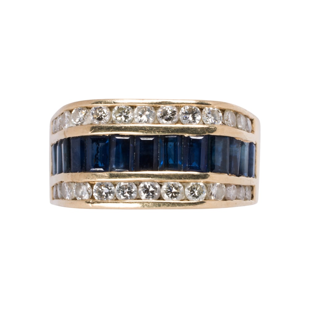 A diamond, sapphire, and 14k gold ring: A diamond, sapphire, and 14k gold ring Centering a row of 13 baguette-cut sapphires, framed on either side by a row of 13 round brilliant-cut diamonds; estimated total sapphire weight: 2.70 carats;