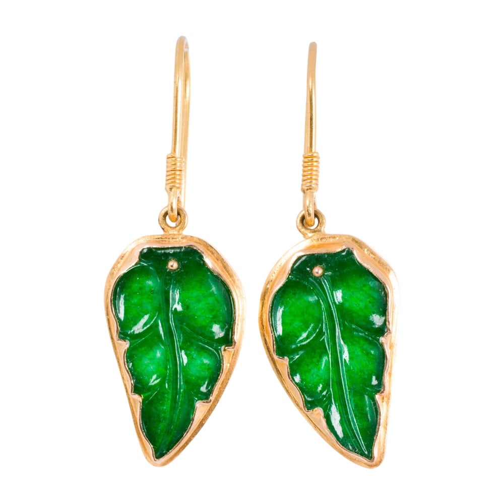 A pair of jade and 18k gold earrings: A pair of jade and 18k gold earrings The earrings featuring carved jade leaves set in 18k gold; length: 1 5/8 in; 5.85 grams