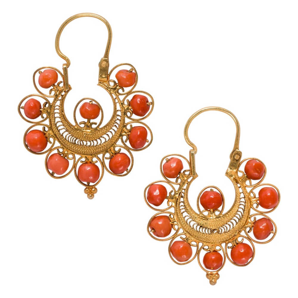 A pair of coral and 14k gold earrings: A pair of coral and 14k gold earrings Of filigree design, set with 10 freeform polished coral beads; length: 1 1/4 in; 3.90 grams