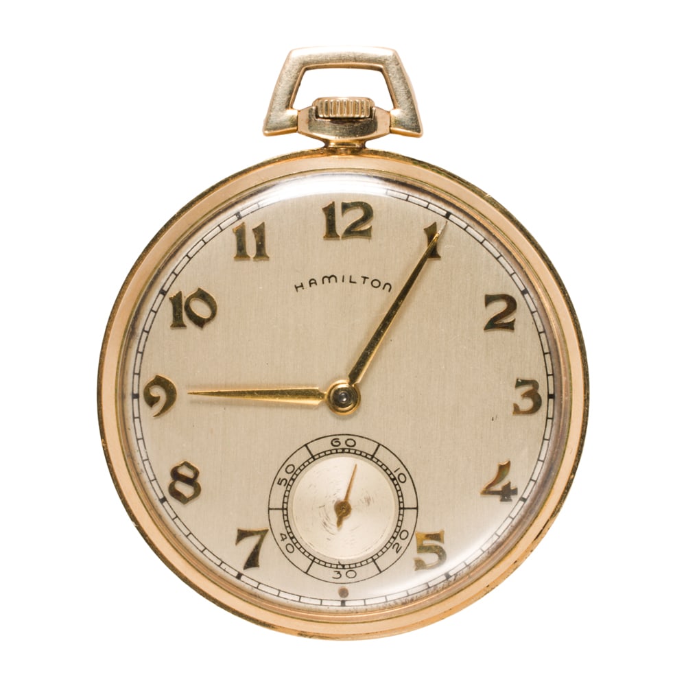 A Vintage gold-filled Hamilton pocket watch: A Vintage gold-filled Hamilton pocket watch The champagne tone face, gold-tone Arabic indices, gold-tone lance hands, subsidiary dial, within polished gold-filled case; case width: 40.78 mm; length: 1