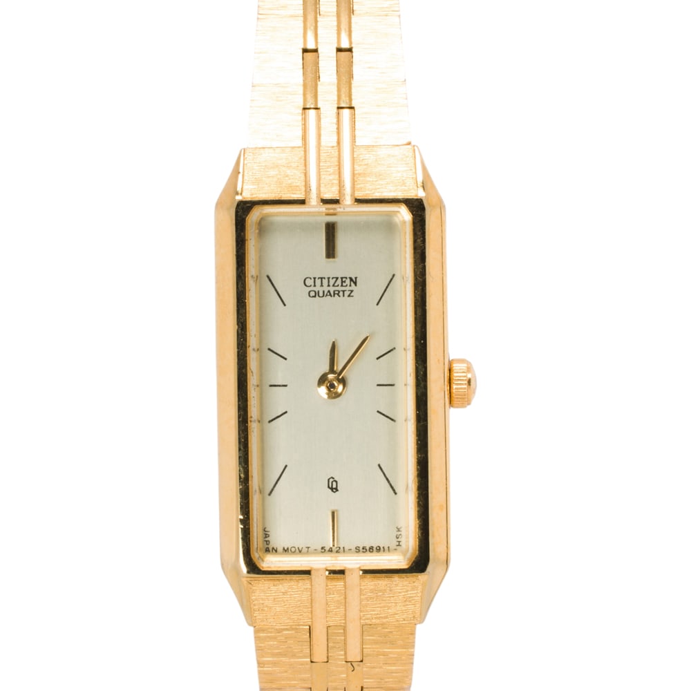 A gold-tone citizen watch: A gold-tone citizen watch Case no.: 090314Movement no.: 5421-S56911The champagne-tone face, black stick indices, gold-tone sword hands, within base metal case, containing a quartz movement, on