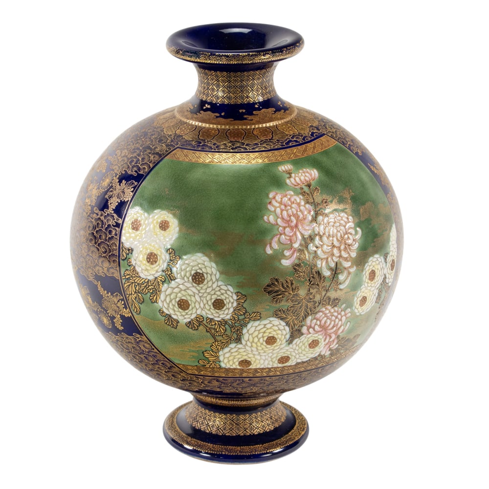 A Satsuma globular vase: A Satsuma globular vase. Depicting peony blossoms and butterflies reserved on a green ground panel, surrounded by cobalt-blue ground with gilt floral design, Kinkozan style, Meiji period, 9.75" high.