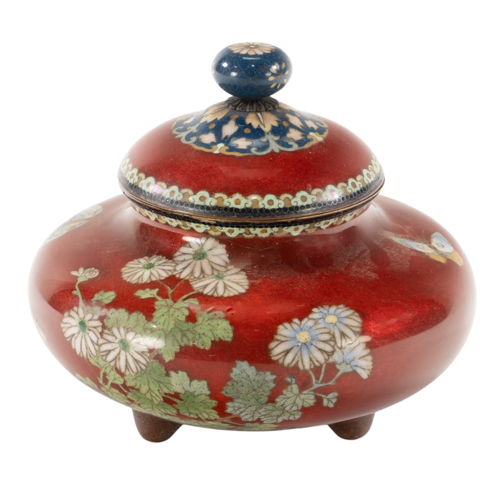 A Japanese cloisonne enamel covered jar attributed to Honda: A Japanese cloisonne enamel covered jar attributed to Honda. Featuring butterfly and floral design, Meiji period, 4.125" high.