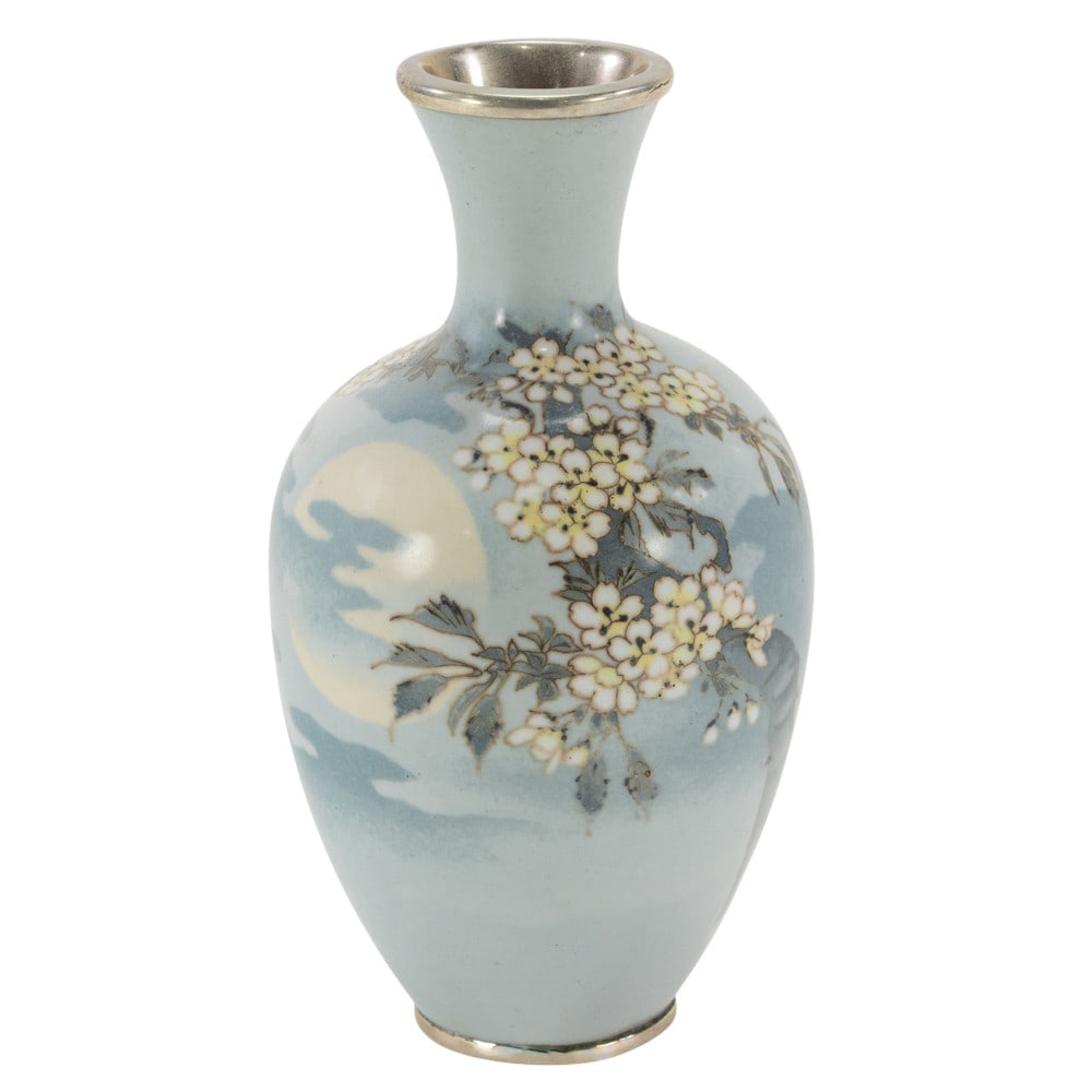 A Japanese cloisonne enamel vase attributed to Namakawa Sosuke: A Japanese cloisonne enamel vase attributed to Namakawa Sosuke. Of baluster form with flared neck, depicting blossoming cherry branches against misty landscape, Meiji period, 5.875" high.