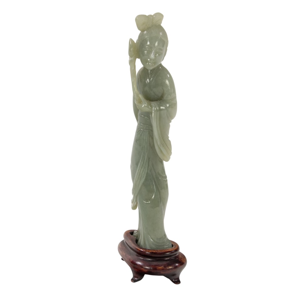 A Chinese celadon jade figure (1 of 3)