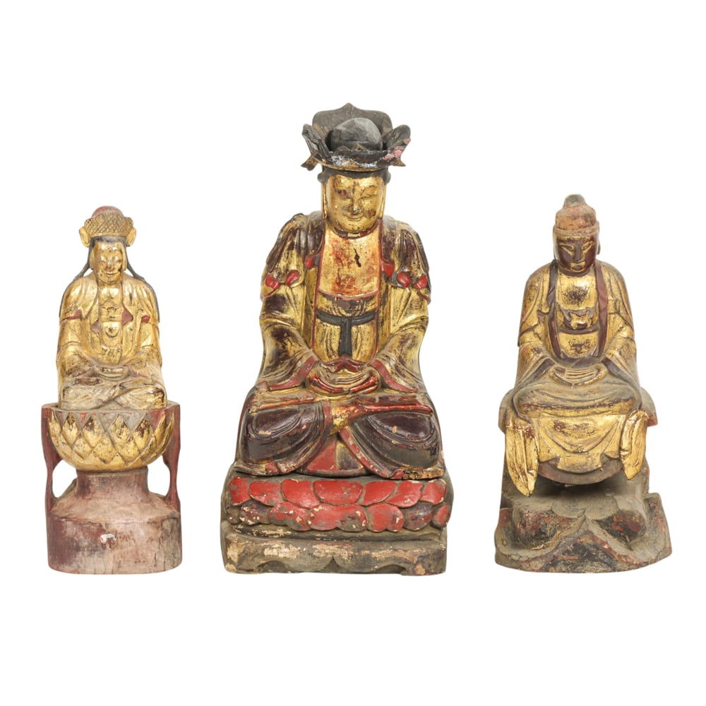 (lot of 3) Chinese lacquered wood Guanyin figures: (lot of 3) Chinese lacquered wood Guanyin figures. Depicting figures seating on lotus and rock base, Qing dynasty, 10.75" to 13" high.